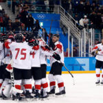 team canada celebrates bronze medal win in men's hockey