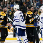 boston bruins and toronto maple leafs shaking hands after game 7
