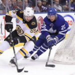morgan reilly defending the zone against boston bruins