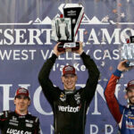 phoenix indycar winner josef newgarden celebrates on podium