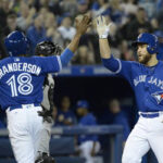 toronto blue jays celebrate run against white sox
