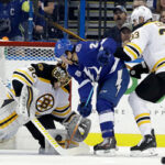 tampa's brayden point attempts to get puck past boston's tuukka rask