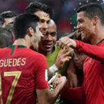 Cristiano Ronaldo celebrates with teamates after scoring a hat trick in match against spain