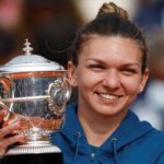 simona halep posing with trophy after defeating sloane stephens in french open