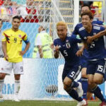 japan celebrates after scoring and defeating columbia
