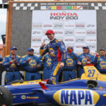 alexander rossi posing with his team after winning at mid-ohio on sunday