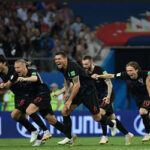 croatia rushes the field in celebration after defeating russia in the shootout to advance to the semi-finals