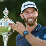 dustin johnson poses with the canadian open trophy after winning the tournament at the gelenn abby in oakville, ontario