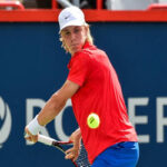 denis shapovalov returning serve in match against robin haas at the 2018 rogers cup in toronto, canada