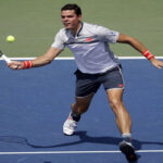 milos raonic returns serve during round two play at the u.s open in flushing meadows, new york on wednesday,
