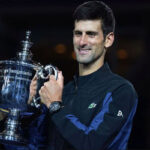 Novak Djokovic poses with the u.s. open mens trophy after defeating juan del potro in three sets on saturday at flushing meadows