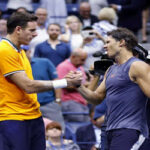 rafael nadal shakes hands with juan del potro after knee injury causes nadal to retire from the u.s. open semifinals