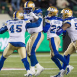 winnipeg blue bombers congratulate kevin fogg last night after defeating the eskimos 30-3