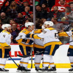 nashville predators celebrate after defeating the calgary flames 5-3 at the scotiabank saddledome
