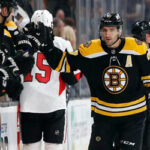 patrice bergeron high-fives bench after scoring against Ottawa