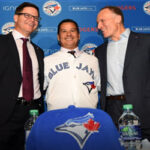 Charlie Montoyo, the new manager of the tornto blue jays poses with Ross Atkins, general manager and Mark Shapiro club president the clubs press conferance on Tuesday at Rogers Centre