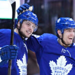 austin matthews celebrates scoring his first goal upon his return with teammate andreas johnsson last night in toronto at the scotia bank arena