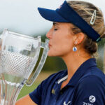 lexi thompson kisses her trophy after winning the CME Group Tour Championship on sunday in naple, florida