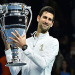 novak djokovic celebrates after defeating john isner at the atp finals