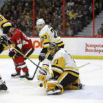 Pittsburgh goaltender casey desmith blocks a shot on goal from the ottawa senators during overtime action saturday night in piitsburgh