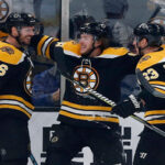 david krejci of the boston bruins celebrates with teammates david pastrnak and brad marchand after scoring last night against toronto.