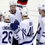 toronto maple leaf tyler ennis is congratulated by fellow teammates after scoring in the third period on Tuesday against the new jersey devils in Newark, new jersey.