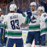 vancouver canucks celebrate after defeating the oilers on thursday in edmonton