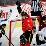 Colorado Avalanche show their disappointment after Calgary’s Mikael Backlund celebrates scoring during the first period in Calgary on Wednesday night