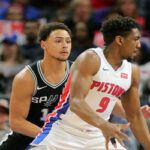 detroit's langston galloway stands guard against a driving bryan forbes of the san antonio spurs last night in detroit