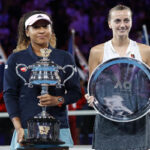 naomi osaka and petra kvitova pose for the media after being awarded their trophies after the women's final at the australian open in melbourne