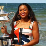 naomi osaka poses for photographs by the ocean in austailia after winning the women's australian open and jumping to the no.1 spot in the wta rankings