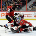 senator's anderson nilsson struggles to locate the puck in a crowded net last night against the colorado avalanche