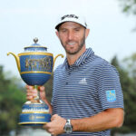 dustin johnson poses with his trophy after winning his 20th pga title at the world golf championship in mexico