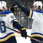 vladimir tarasenko is congratulated by teammate ryan o'reilly after scoring a first period goal last night in st. paul minnesota
