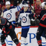 Winnipeg’s Mark Scheifele and jets captain blake wheeler celebrate after one of the jets eight goals last night in north Carolina.