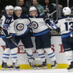 brendan tanev joins adam lowry after the jets scored third third goal last night to win thier third game in a row last night in los angeles