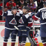 colorado avalanche's nikita zadorov celebrates with teammates after defeating the chicago blackhakws in denver, colorado on saturday