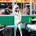 lewis hamilton waves to the crowds after posting the fastest qualifying session and earning pole position