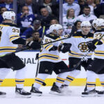 boston's zdeno chara,brad marchand and patrice bergeron celebrate after tying the series 2-2 on wednesday night in toronto