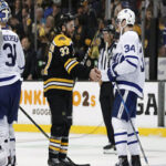 frederik andersen, auston matthews and mitch marner shake hands with the boston bruins after losing in game 7 of the first round