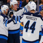 josh morrissey and bryan little of the winnipeg jets celebrate after scoring in the second period against the st. louis blues on sunday in winnipeg