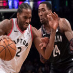 kawhi leonard of the toronto raptors drives towards the brooklyn's net as rondae hollis-jefferson attempts to block last night in new york