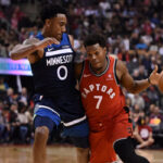 kyle lowry of the toronto raptors drives past jeff teague of the minnesota timberwolves towards the net