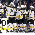 team captain Zdeno Chára high fives Nicklas Bäckström after the boston bruins swept thier series against the Columbus Blue Jackets in game 6 on monday night