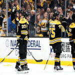 the boston bruins congratulate each other after a landslide victory in game 2 of the eastern conference finals against the carolina hurricanes