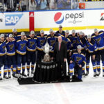 the st. louis blues pose for team pictures after winning the western conference final on tuesday