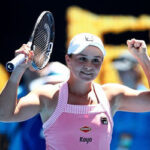 Australia’s Ashleigh Barty raises her racket in celebration after winning the 2019 Australian Open