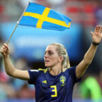 Linda Sembrant waves Sweden's national flag after defeating Germany 2-1 to advance to the semifinals at the 2019 Women's World Cup
