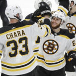 boston's zdeno chara joins his teammates to celbrate after winning game 6 and forcing game 7 in the stanley cup finals.