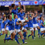 the italian women's team rush the field after defeating china to advance to the quarterfinals on tuesday